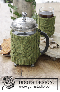 Christmas Brew / DROPS Extra 0-1402 - DROPS Christmas: Knitted cover with cables for press pot and cup. Piece is knitted in DROPS Lima.