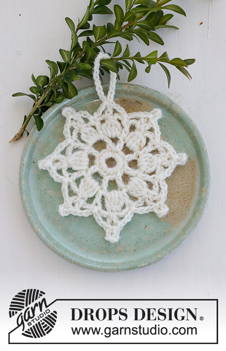 Sparkling Snow / DROPS Extra 0-1517 - Crocheted star-shaped Christmas decoration / coaster in DROPS Muskat. Theme: Christmas.