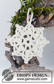Sparkling Snow / DROPS Extra 0-1517 - Crocheted star-shaped Christmas decoration / coaster in DROPS Muskat. Theme: Christmas.