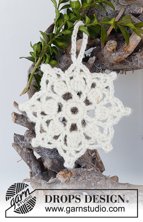 Sparkling Snow / DROPS Extra 0-1517 - Crocheted star-shaped Christmas decoration / coaster in DROPS Muskat. Theme: Christmas.