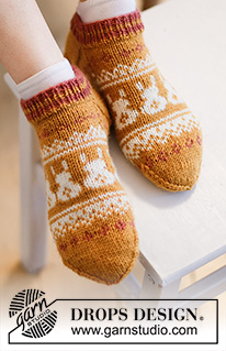 Bunny Steps / DROPS Extra 0-1537 - Calcetines de punto en DROPS Karisma. La pieza está tejida de arriba para abajo con patrón de jacquard nórdico y conejos de Pascua. Números 35 – 46. Tema: Pascua.