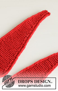 Shawl We Toast? / DROPS Extra 0-1613 - Knitted bottle shawl in DROPS BabyMerino. The piece is worked back and forth in garter stitch. Theme: Christmas.