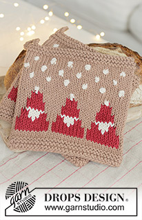 Snowy Claus Potholders / DROPS Extra 0-1627 - Knitted pot holder in DROPS Paris. The piece is worked bottom up with Santas, bobbles and snowflakes. Theme: Christmas.