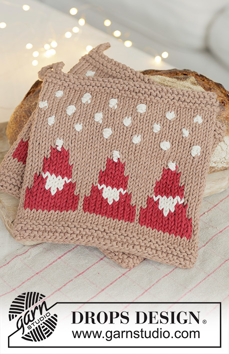Snowy Claus Potholders / DROPS Extra 0-1627 - Knitted pot holder in DROPS Paris. The piece is worked bottom up with Santas, bobbles and snowflakes. Theme: Christmas.