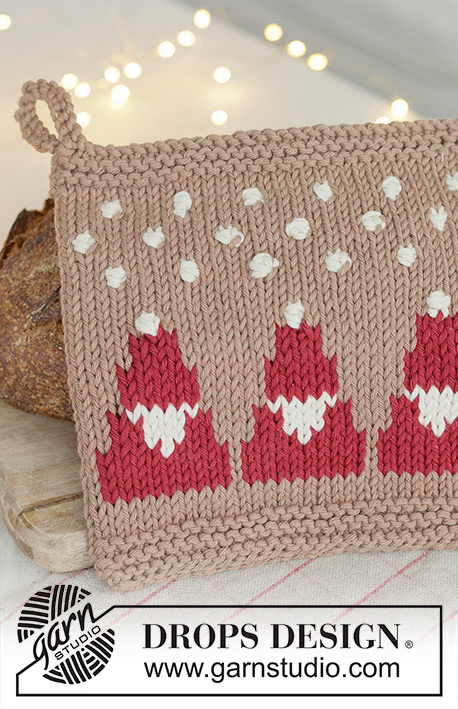 Snowy Claus Potholders / DROPS Extra 0-1627 - Knitted pot holder in DROPS Paris. The piece is worked bottom up with Santas, bobbles and snowflakes. Theme: Christmas.