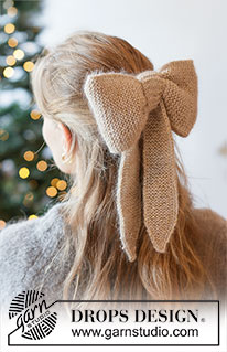 Yuletide Ribbon / DROPS Extra 0-1631 - Strikket sløjfe / julepynt i DROPS Flora, DROPS Kid-Silk og DROPS Glitter. Arbejdet strikkes fra side til side i retstrik med i-cord. Tema: Jul.