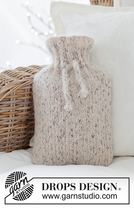 Shimmering Snow Cover / DROPS Extra 0-1641 - Knitted cover for hot-water bottle in DROPS Fabel and DROPS Melody. Piece is knitted bottom up in stocking stitch. Theme: Christmas.