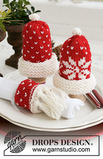 Nissetopp / DROPS Extra 0-580 - Couvre-œuf et rond de serviette tricotés en DROPS Karisma. Le couvre-œuf se tricote en forme de bonnet de Père Noël et le rond de serviette comme une écharpe. Thème: Noël.