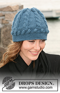 Blue Fog / DROPS 102-25 - DROPS Hat and gloves in ”Silke-Alpaca” with cables and bubbles and crocheted edge.