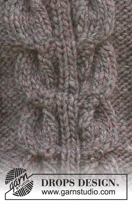 DROPS 102-35 - Long DROPS blouse in ”Snow” with cables and Rib. Sizes S - XXXL
