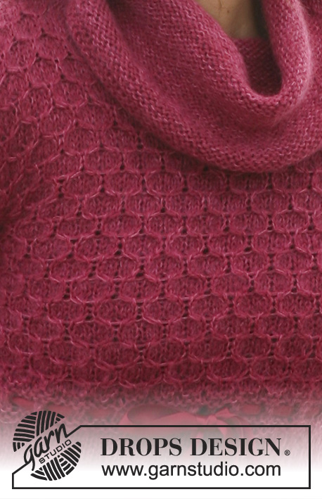 Raspberry Marmalade / DROPS 117-39 - DROPS klänning i ”Alpaca” och ”Kid-Silk” med 3/4-långa ärmar och bikubemönster på okstycket och i nederkanten. Strl XS till XXL