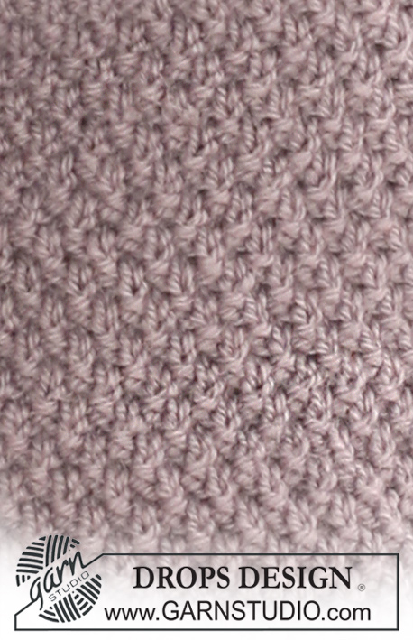 Pearls in Provence / DROPS 126-9 - Cardigan DROPS en punto arroz con “Nepal. Talla S - XXXL.
Diseño DROPS: Patrón No. NE-022
