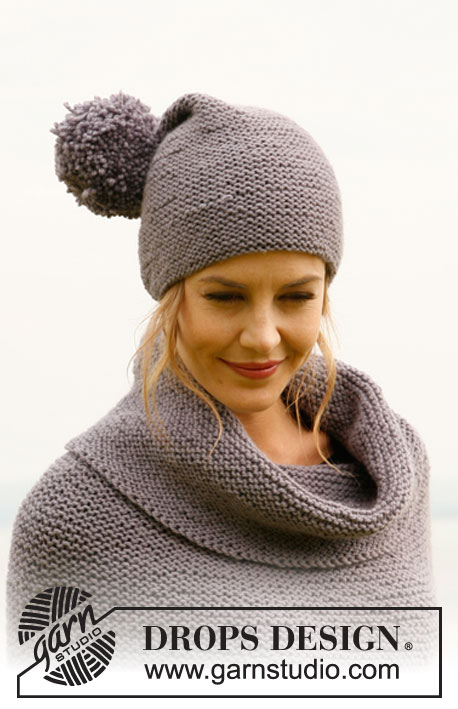 Macy Mae / DROPS 134-16 - Gebreide DROPS poncho met franjes en wijde kol en muts met pompom in ribbelst van ”Nepal”. Maat: S tot en met XXXL