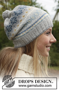 Autumn Aurora / DROPS 143-28 - Set consist of: Knitted DROPS poncho, hat and wrist warmers with fair-isle pattern in ”Alpaca”. Size: S - XXXL.