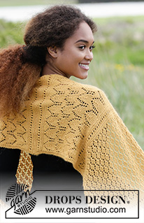 Dreamy Daffodil / DROPS 180-14 - Knitted stole with lace pattern and rib.
The piece is worked in DROPS Alpaca.