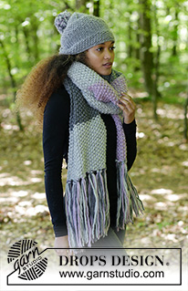 So Chill / DROPS 182-34 - The set consists of: Knitted scarf in seed stitch with fringe and hat with stripes in stockinette stitch and seed stitch.
The piece is worked in DROPS Snow.