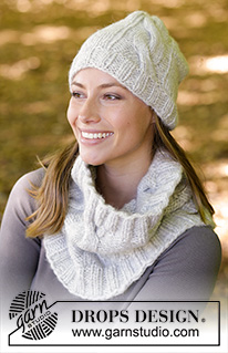 Snowbound / DROPS 182-39 - The set consists of: Knitted hat, neck warmer and mittens with cables.
The set is worked with 2 strands DROPS Air.