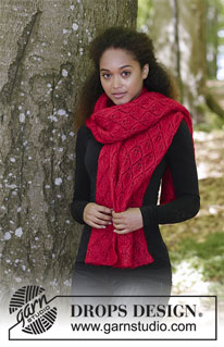 Hot Coal / DROPS 183-7 - De set bestaat uit: Gebreide sjaal en muts met kantpatroon. 
De set wordt gebreid in DROPS Lace en DROPS Kid-Silk.