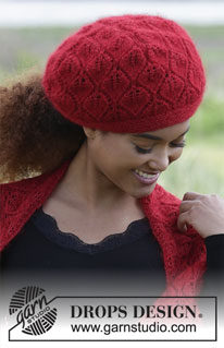 Hot Coal / DROPS 183-7 - De set bestaat uit: Gebreide sjaal en muts met kantpatroon. 
De set wordt gebreid in DROPS Lace en DROPS Kid-Silk.