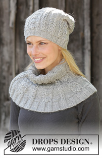 Ice Skating Set / DROPS 192-46 - Knitted neck warmer in DROPS Karisma. Piece is knitted with cables and bobbles.
Knitted mittens in DROPS Karisma. Piece is knitted with cables and bobbles.
Knitted hat in DROPS Karisma. Piece is knitted with cables and bobbles.