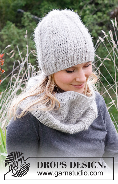 Whispering Wind / DROPS 214-45 - Crocheted hat and neck warmer in DROPS Sky and DROPS Kid-Silk. Piece is crocheted with loop - cables and relief stitches.