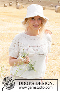 White Moon Top / DROPS 223-13 - Strikket bluse med korte ærmer i DROPS Cotton Merino eller DROPS Merino Extra Fine. Arbejdet strikkes i glatstrik med rundt bærestykke, hulmønster på bærestykket og kanter i rib. Størrelse XS - XXL.