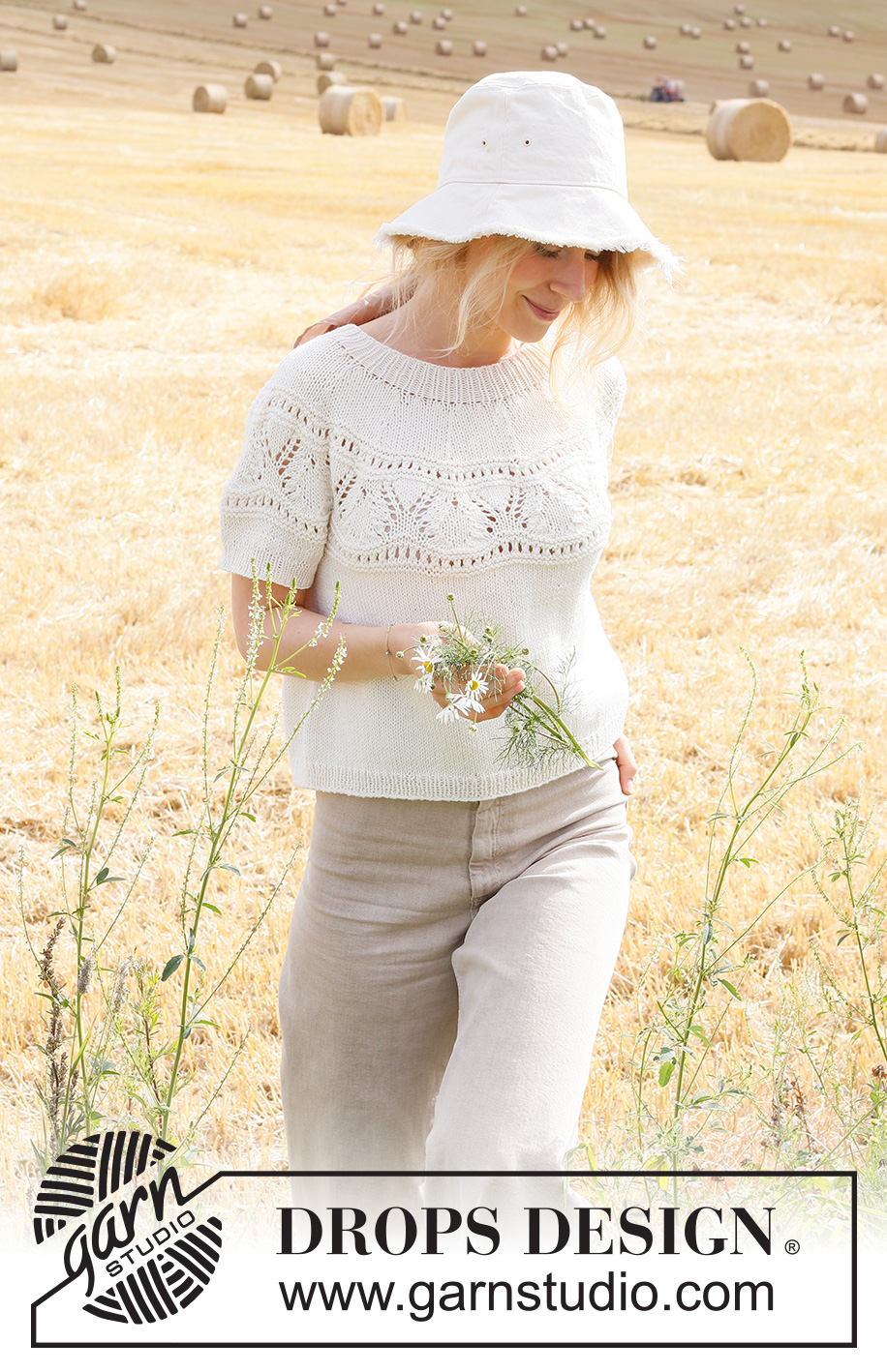 White Moon Top / DROPS 223-13 - Strikket bluse med korte ærmer i DROPS Cotton Merino eller DROPS Merino Extra Fine. Arbejdet strikkes i glatstrik med rundt bærestykke, hulmønster på bærestykket og kanter i rib. Størrelse XS - XXL.