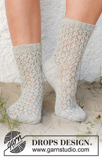Rain Runners / DROPS 223-43 - Knitted socks in DROPS Nord. The piece is worked with lace pattern. Sizes 35-43 = US 4 1/2 – 12 1/2.