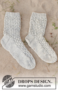 Rain Runners / DROPS 223-43 - Knitted socks in DROPS Nord. The piece is worked with lace pattern. Sizes 35-43 = US 4 1/2 – 12 1/2.