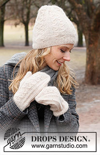 Rolling Snow Set / DROPS 226-53 - Knitted hat and mittens in DROPS Air. The piece is worked with cables and Fisherman’s rib.