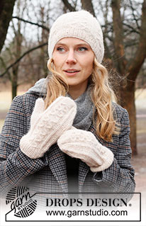 Rolling Snow Set / DROPS 226-53 - Knitted hat and mittens in DROPS Air. The piece is worked with cables and Fisherman’s rib.