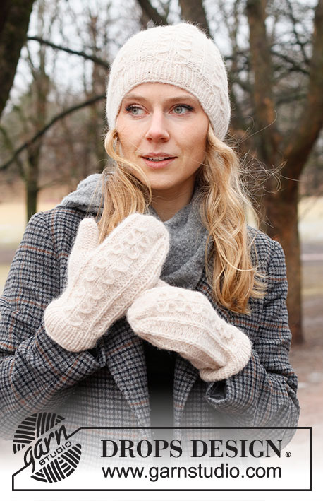 Rolling Snow Set / DROPS 226-53 - Knitted hat and mittens in DROPS Air. The piece is worked with cables and Fisherman’s rib.