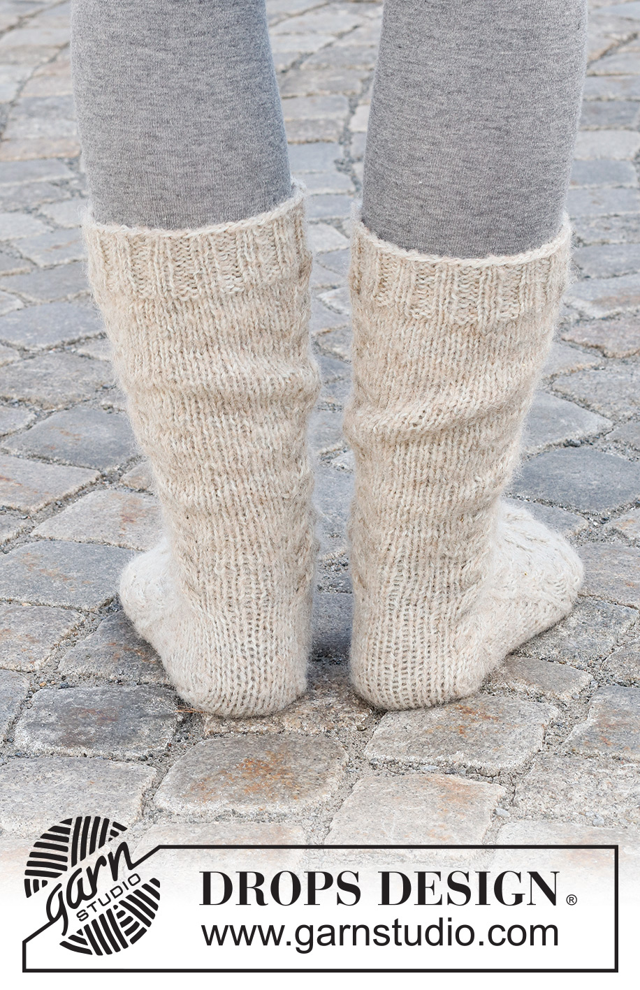 Cable City Socks / DROPS 227-66 - Stickade sockor i DROPS Nord och DROPS Brushed Alpaca Silk. Arbetet stickas uppifrån och ner med flätor. Storlek 35 - 43.