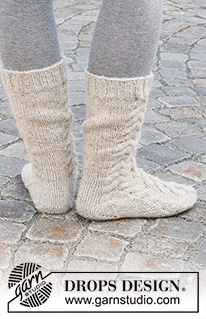 Cable City Socks / DROPS 227-66 - Stickade sockor i DROPS Nord och DROPS Brushed Alpaca Silk. Arbetet stickas uppifrån och ner med flätor. Storlek 35 - 43.