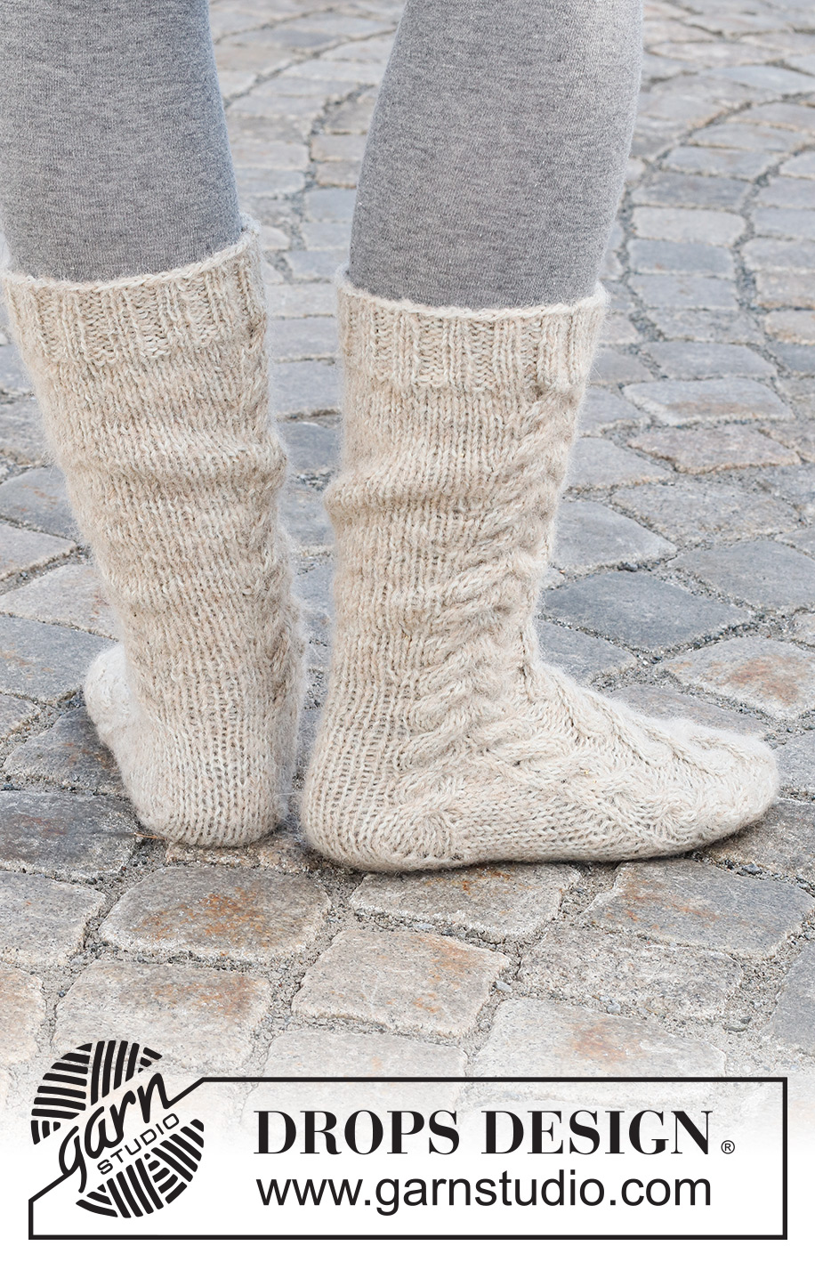 Cable City Socks / DROPS 227-66 - Stickade sockor i DROPS Nord och DROPS Brushed Alpaca Silk. Arbetet stickas uppifrån och ner med flätor. Storlek 35 - 43.
