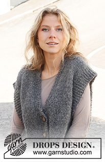 December Skies / DROPS 228-32 - Strikket vest i DROPS Alpaca Bouclé og DROPS Kid-Silk. Arbeidet strikkes med splitt i sidene, v-hals og kanter i vrangbord. Størrelse XS - XXL.