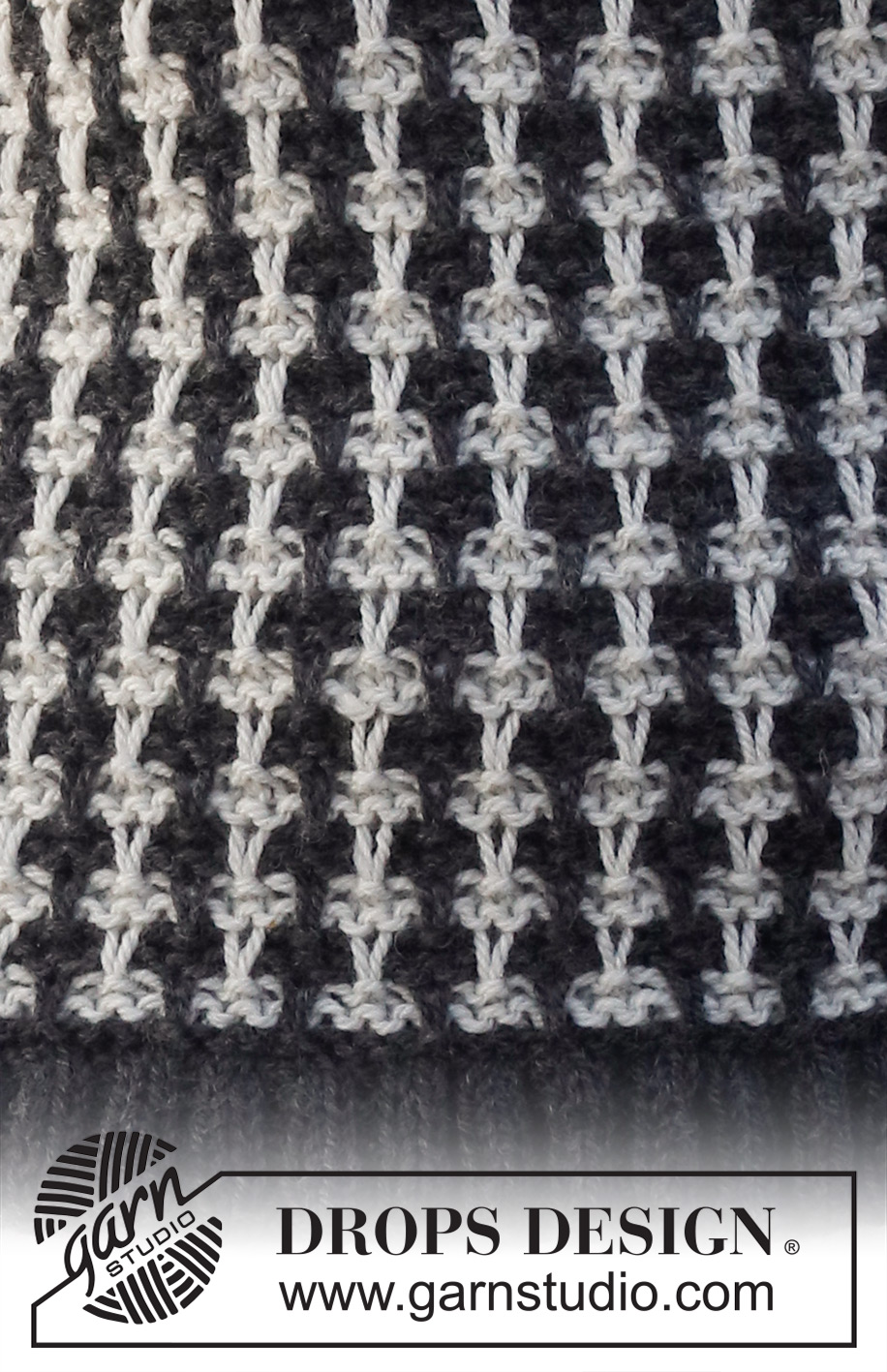 Cambridge Connection / DROPS 228-36 - Knitted vest in DROPS Alaska. Piece is knitted with pepita pattern and edges in rib. Size: S - XXXL