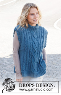 December Tide Vest / DROPS 228-40 - Knitted vest in DROPS Flora and DROPS Kid-Silk or DROPS Alpaca and DROPS Kid-Silk. The pieced is worked with cables, double neck and split in the slides. Sizes S - XXXL.