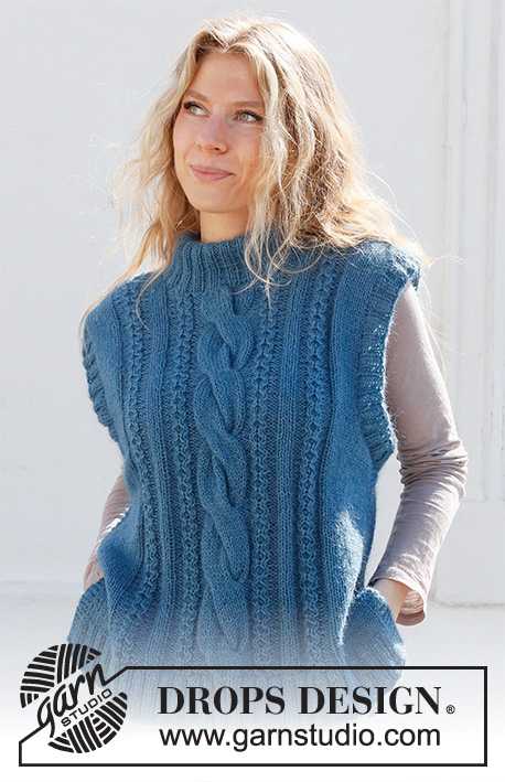 December Tide Vest / DROPS 228-40 - Knitted vest in DROPS Flora and DROPS Kid-Silk or DROPS Alpaca and DROPS Kid-Silk. The pieced is worked with cables, double neck and split in the slides. Sizes S - XXXL.