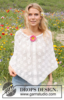 Daisy Droplets / DROPS 229-16 - Crocheted poncho in DROPS Cotton Merino. The piece is worked top down with lace pattern and bobbles. Sizes S - XXXL.
