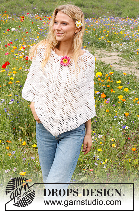 Daisy Droplets / DROPS 229-16 - Crocheted poncho in DROPS Cotton Merino. The piece is worked top down with lace pattern and bobbles. Sizes S - XXXL.