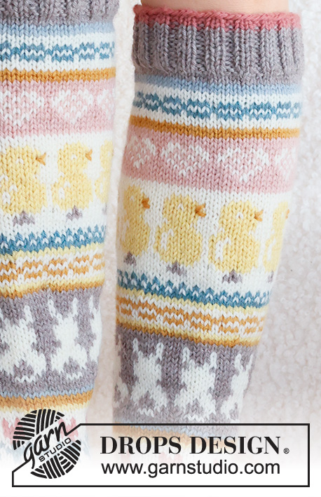 Easter Dance Socks / DROPS 229-35 - Knitted socks in DROPS Karisma. The piece is worked top down in stocking stitch, with multi-coloured pattern and heart, Easter chick, Easter bunny and flower. Sizes 35 - 43. Theme: Easter.