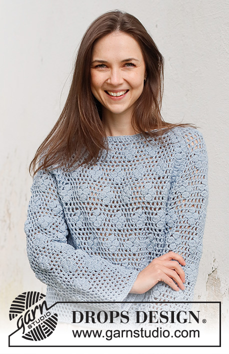 Cloud Catcher / DROPS 230-32 - Virkad tröja i DROPS Cotton Merino. Arbetet virkas uppifrån och ner med raglan, hålmönster, muscher och solfjädersmönster. Storlek S - XXXL.