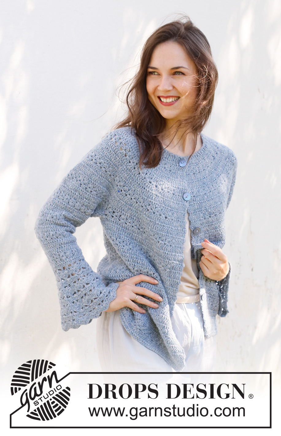 Spring Renaissance Cardigan / DROPS 230-38 - Crocheted jacket in DROPS Sky. The piece is worked top down with round yoke, lace and fan pattern and trumpet sleeves. Sizes S - XXXL.