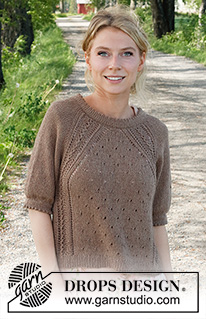 New Land / DROPS 232-9 - Strikket bluse i DROPS Belle. Arbejdet strikkes oppefra og ned med raglan, hulmønster, dobbelt kanter og korte ærmer. Størrelse S - XXXL.
