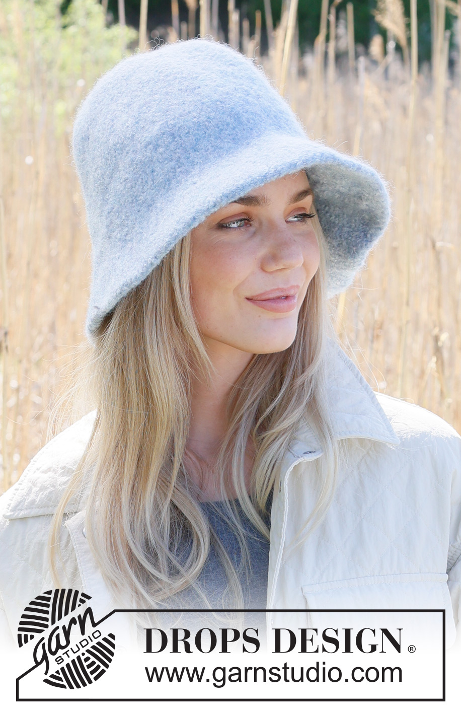 Blue Ice Hat / DROPS 234-11 - Knitted and felted hat in DROPS Snow. Piece is knitted back and forth, bottom up in stocking stitch with brim.