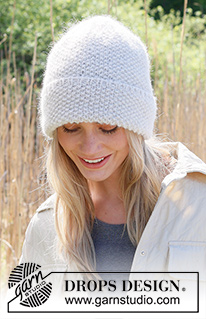 Lovebird / DROPS 234-44 - Knitted hat in DROPS Lima and DROPS Brushed Alpaca Silk. Piece is knitted bottom up in moss stitch.