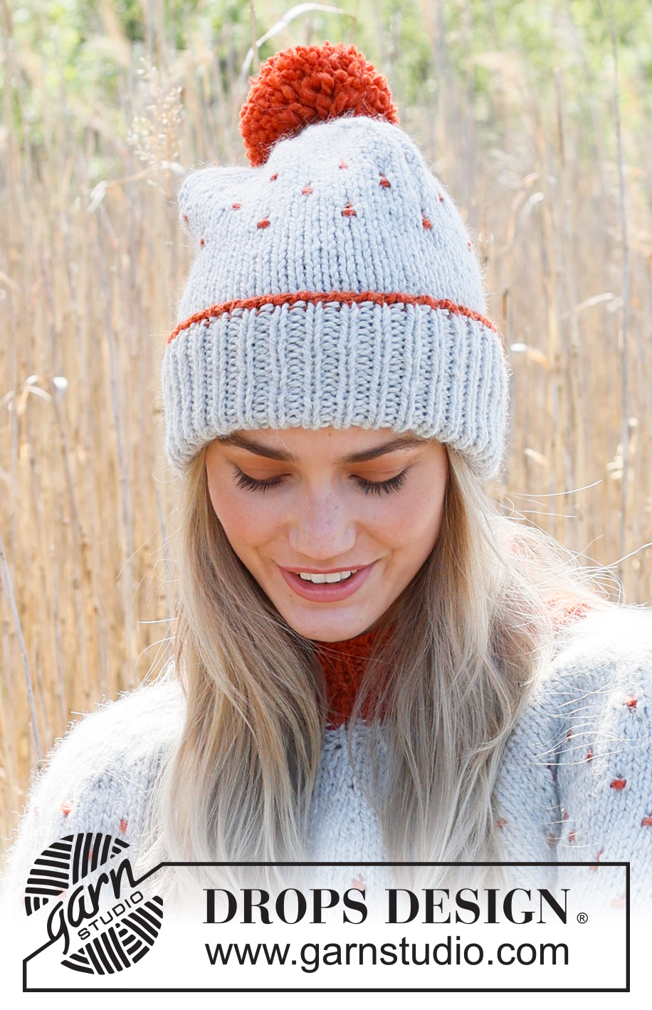 Cranberry Splash Hat / DROPS 234-45 - Knitted hat in DROPS Andes. Piece is knitted top down with edge in rib, multi-colored pattern and pompom.