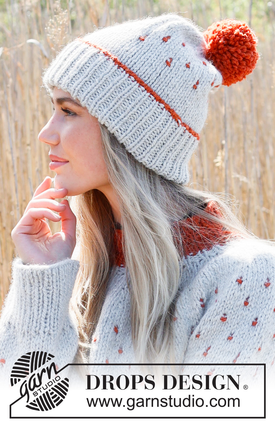 Cranberry Splash Hat / DROPS 234-45 - Knitted hat in DROPS Andes. Piece is knitted top down with edge in rib, multi-colored pattern and pompom.