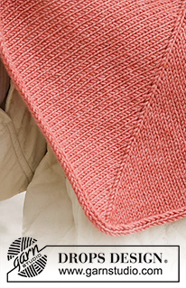 Spanish Rose / DROPS 234-49 - Gebreide omslagdoek in DROPS Merino Extra Fine. Het werk wordt van boven naar beneden gebreid, met tricotsteek en punnikrand.